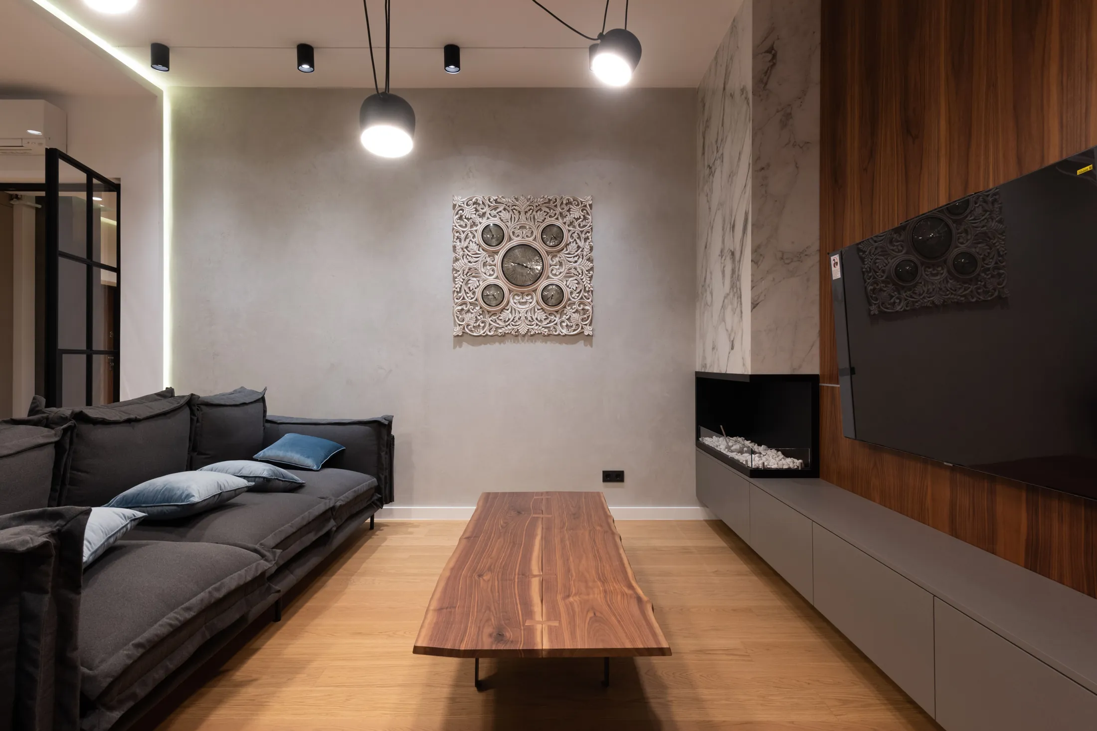 The drawing room at Rue Verane with its walnut wall and fireplace